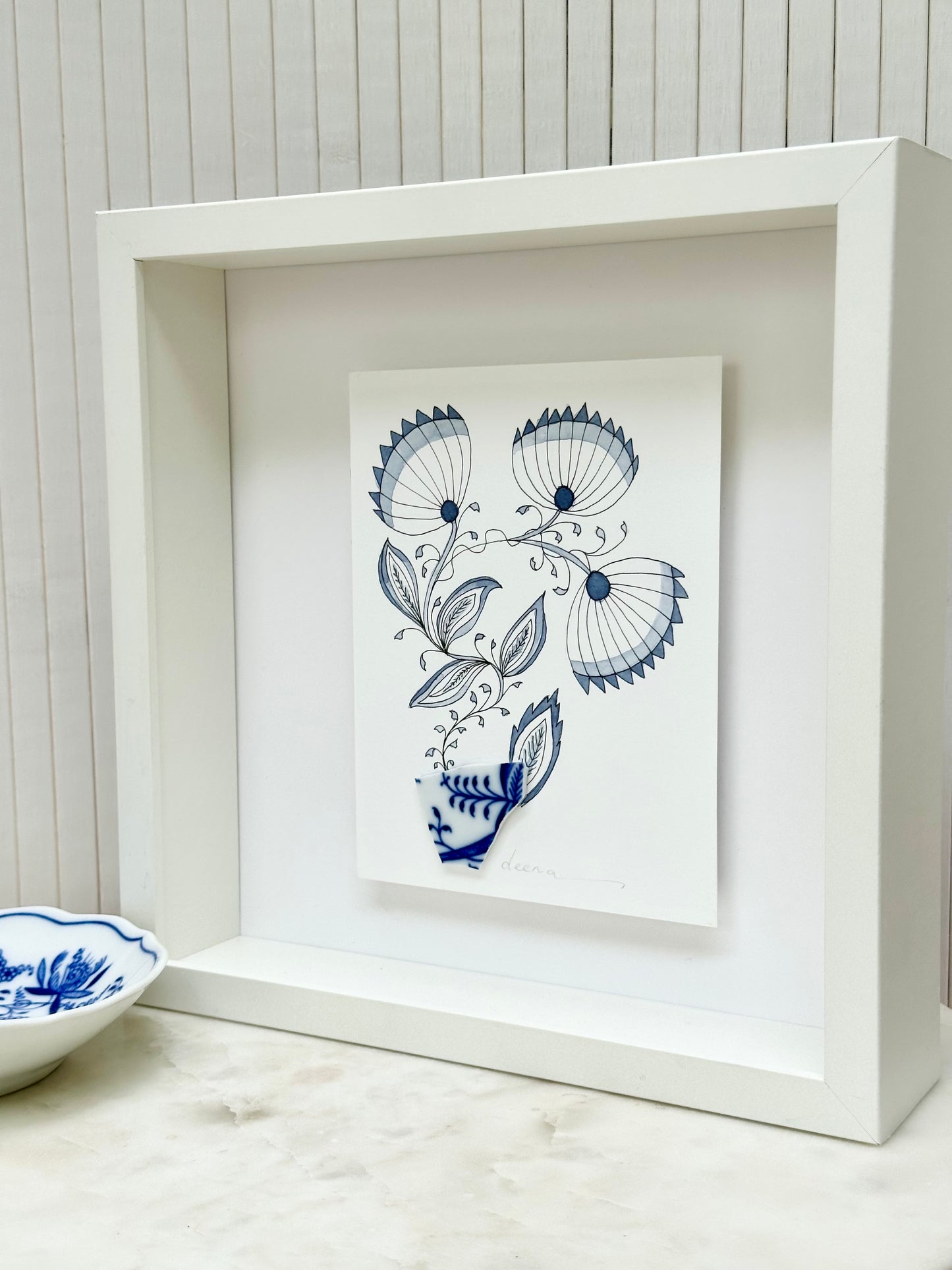 Original mixed media artwork featuring hand-painted flowers with a reclaimed glass shards as a sculptural vase. Unique, sustainable wall art framed and ready to hang.