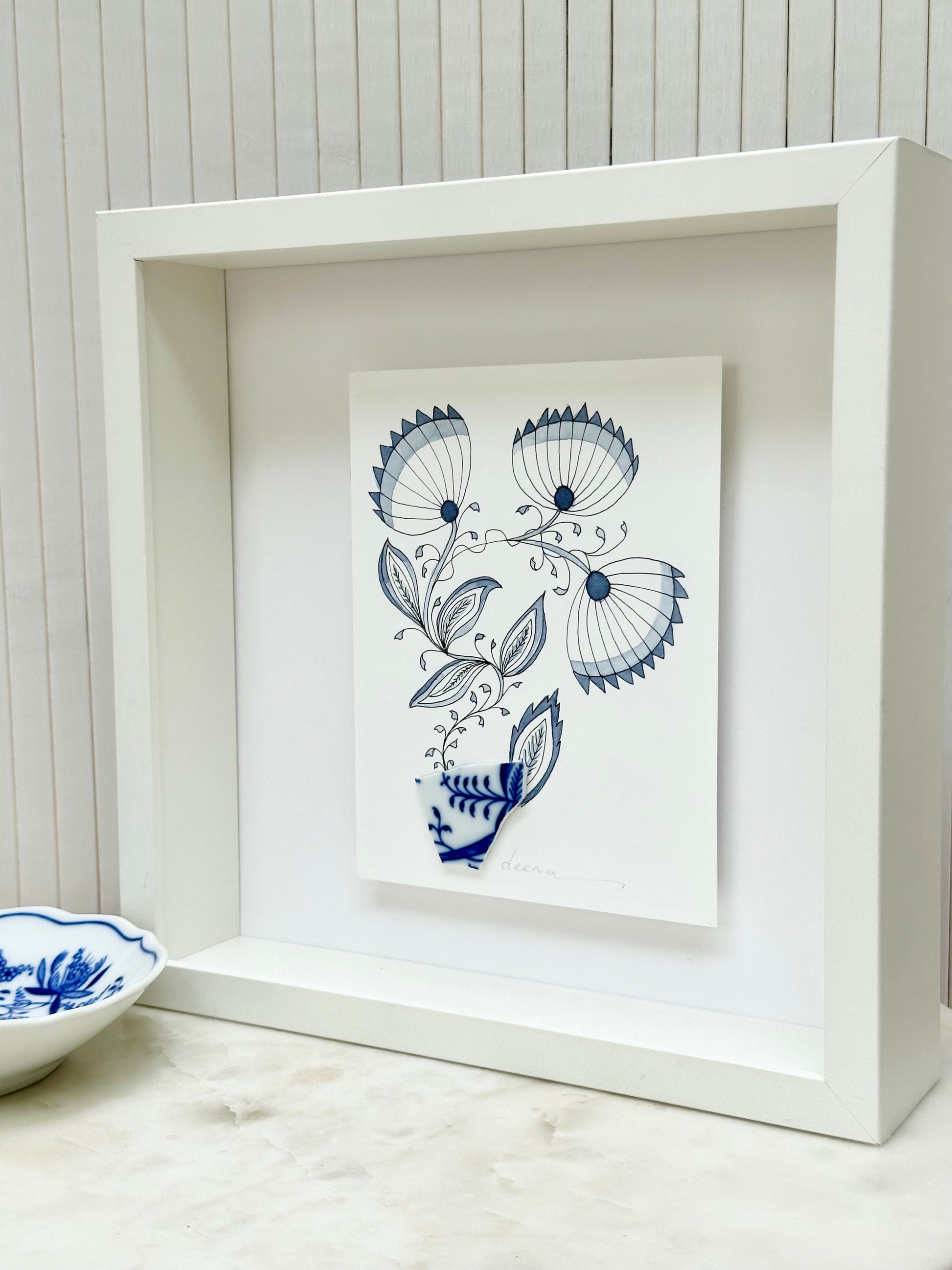 Original mixed media artwork featuring hand-painted flowers with a reclaimed glass shards as a sculptural vase. Unique, sustainable wall art framed and ready to hang.