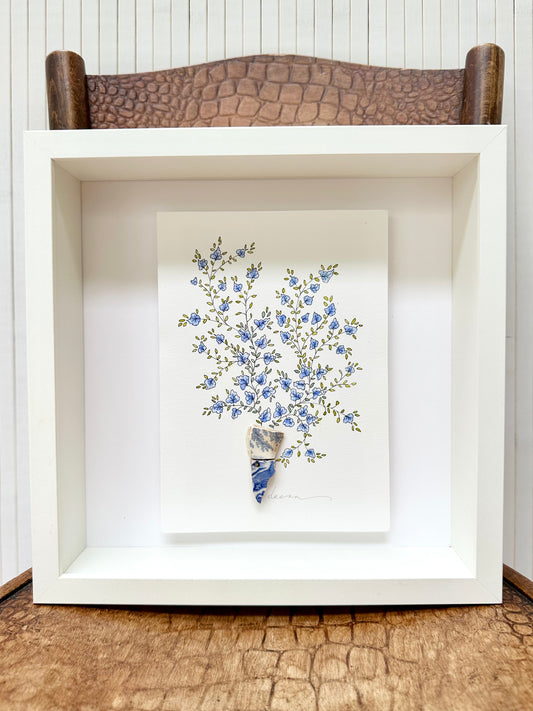 Original mixed media artwork featuring hand-painted flowers with a reclaimed glass or china shards as a sculptural vase. Unique, sustainable wall art framed and ready to hang.