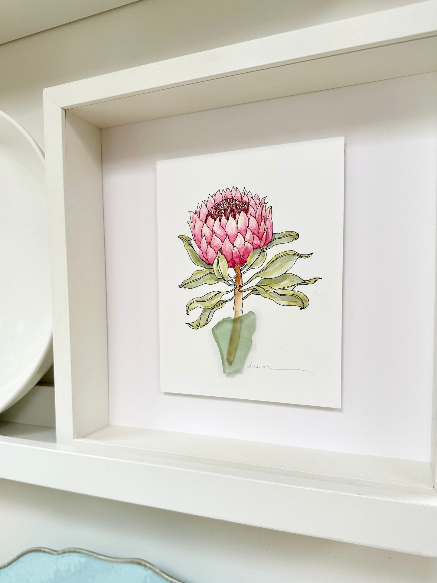 Original mixed media artwork featuring hand-painted flowers with a reclaimed glass shards as a sculptural vase. Unique, sustainable wall art framed and ready to hang.